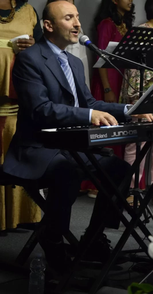 ICCRome elder, Fabio, playing the keyboard